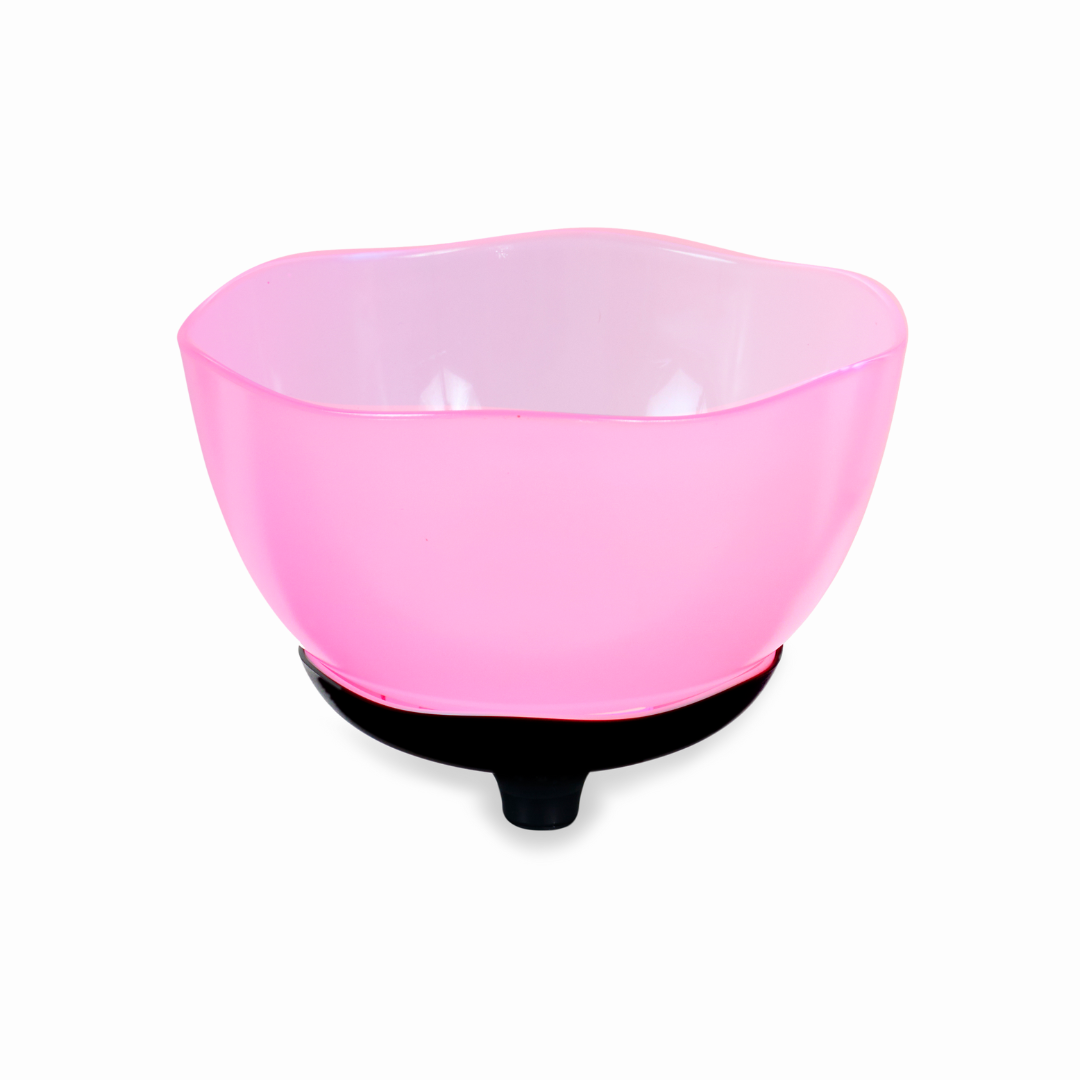 A translucent pink bowl with a wavy rim sits elegantly atop a black base, resembling the smooth curves of modern Golden Tech Optional Lift Chair Upgrades for the PR511 Recliner. Its glossy finish gleams subtly, highlighting its delicate craftsmanship as it rests effortlessly empty.